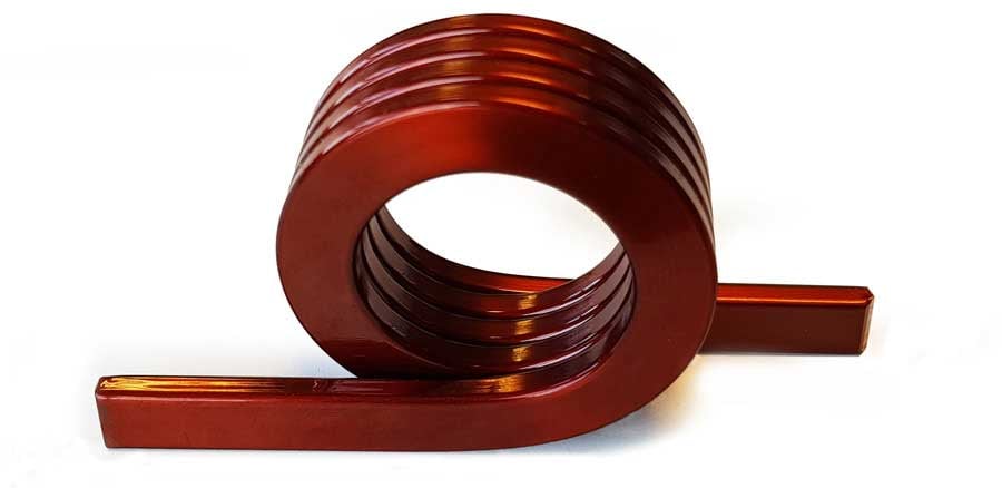 Edgewise winding is one of the modern trends in coil manufacturing. The principle of this winding technology is that the rectangular section wire is wound not on the flat part of the wire but on the short side of the wire. That’s what the terms edgewise winding or side-winding stands for.